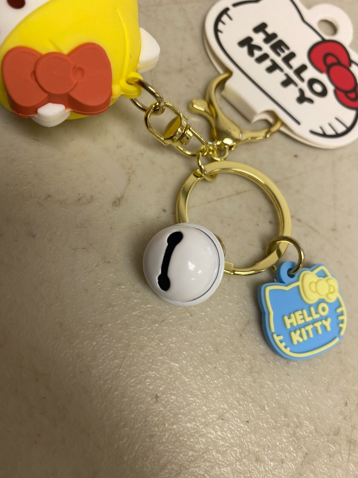 New Assorted Silicone Hello Kitty Keychain with Blue outfit and bell accessory