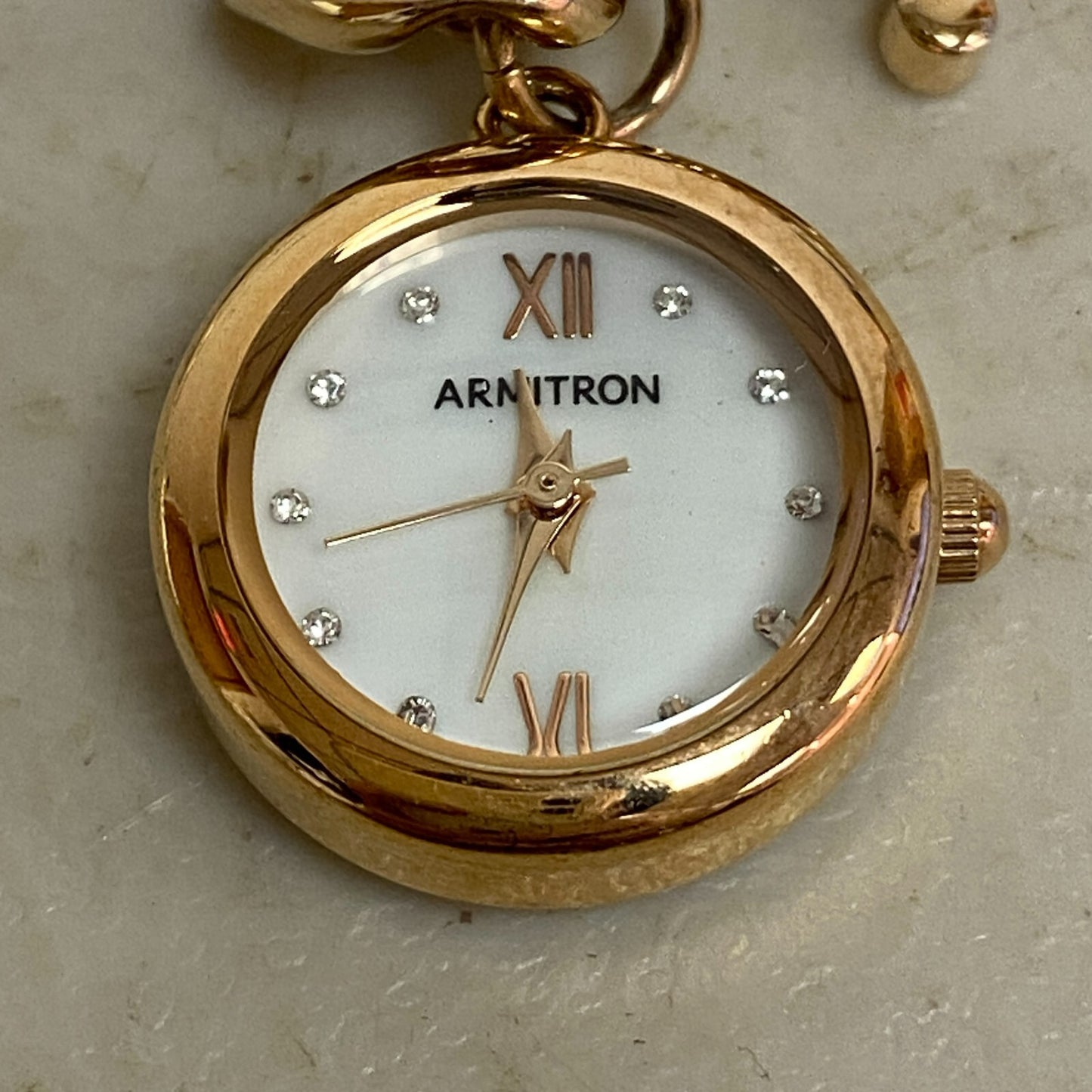 Armitron Women link bracelet with charm watch with key and lock charms 75/5067RG