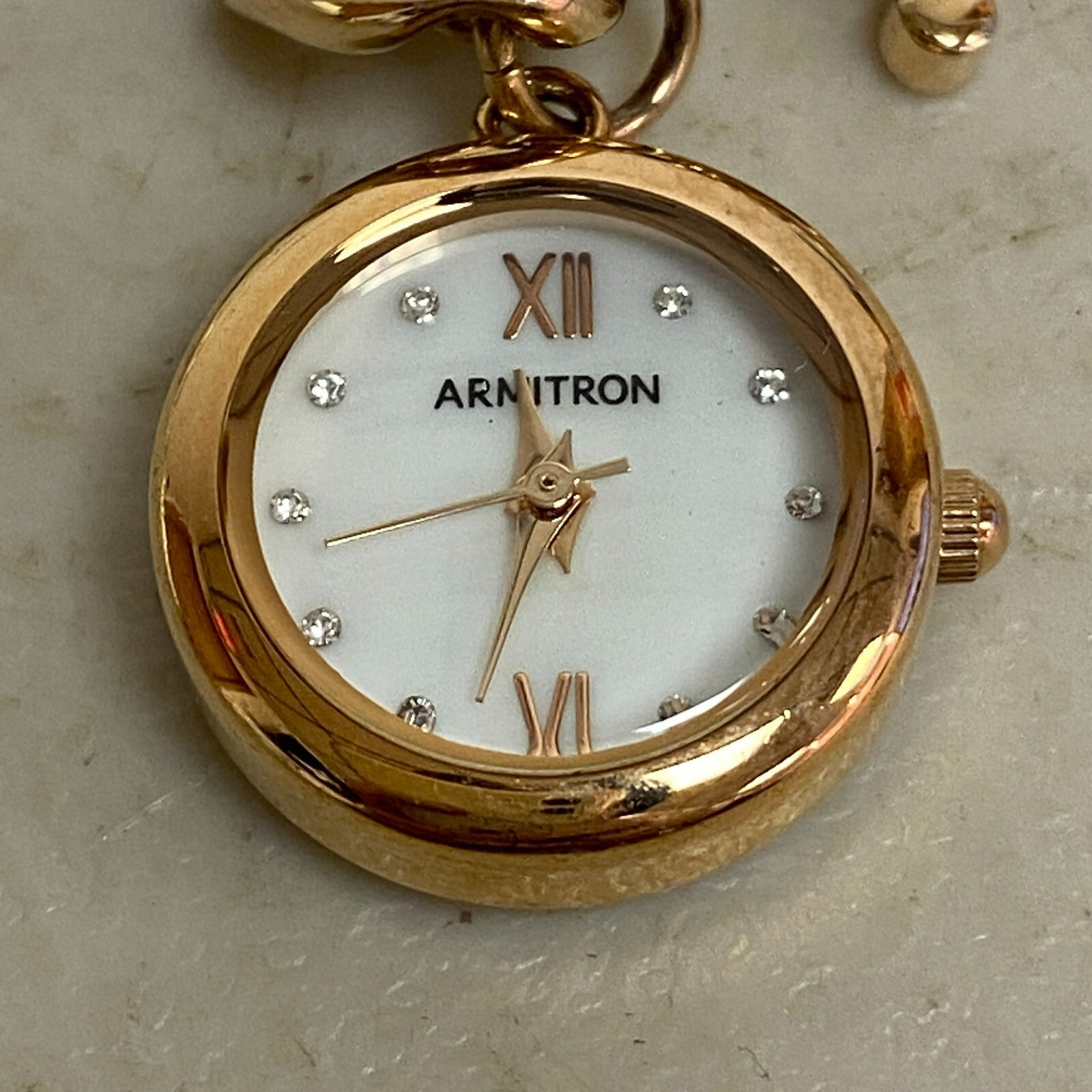 Armitron Women link bracelet with charm watch with key and lock charms 75/5067RG