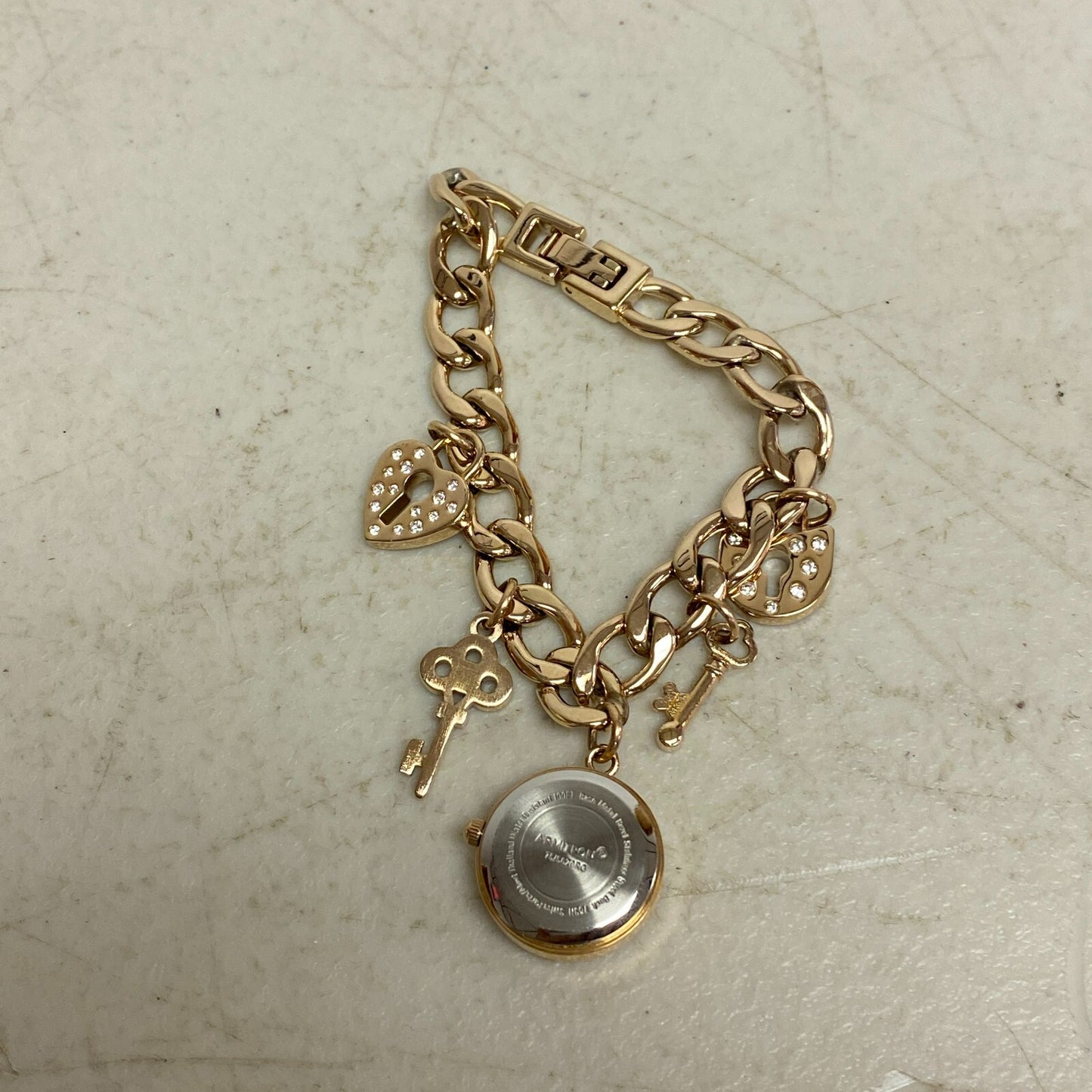 Armitron Women link bracelet with charm watch with key and lock charms 75/5067RG