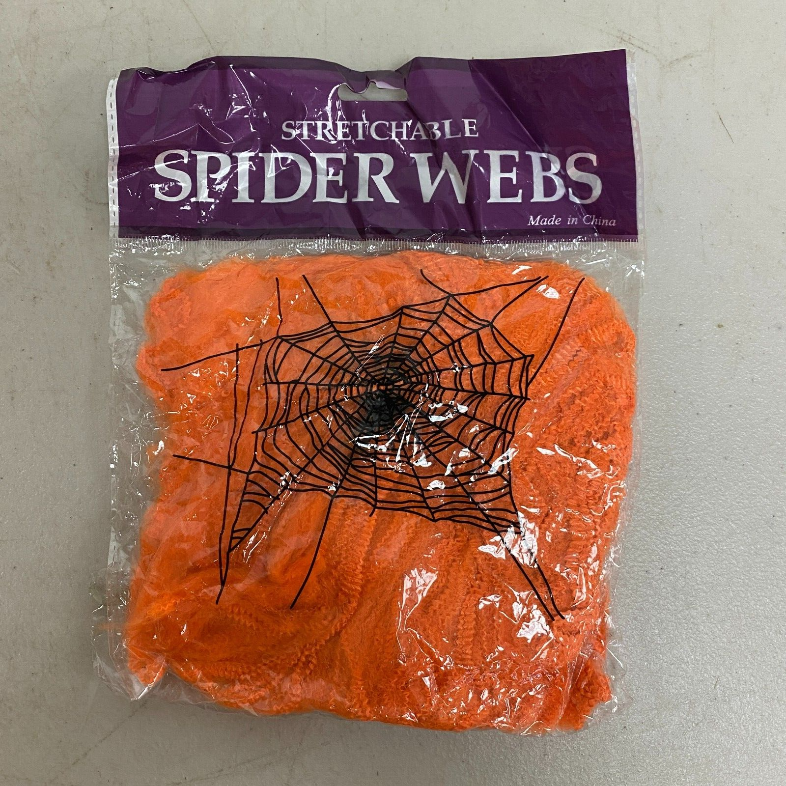 Stretchable Spider Web Decoration Orange w/ black spider Accents