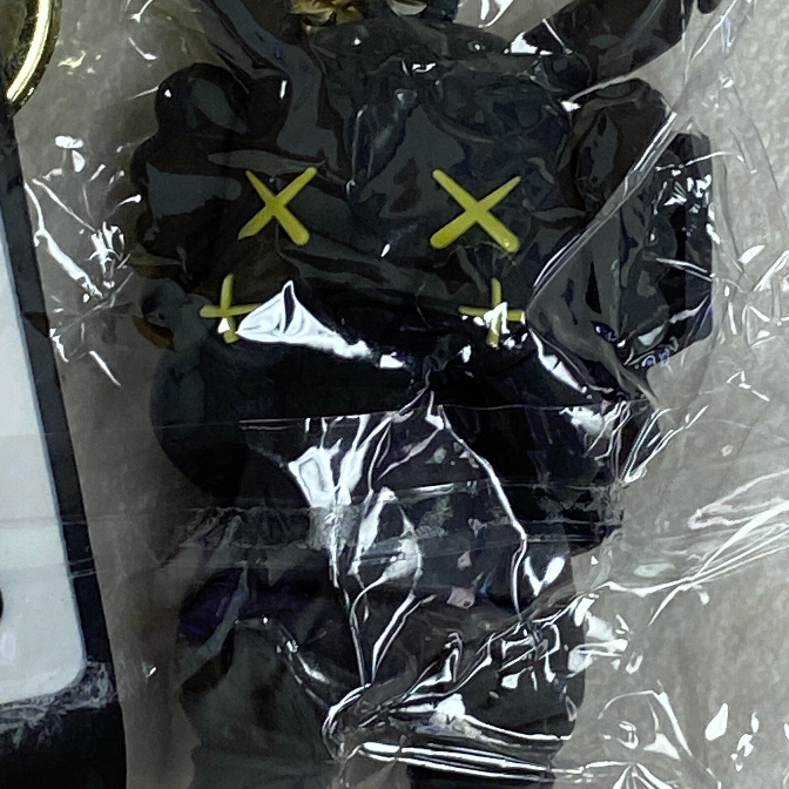 Assorted Carmela Indigo Silicone Keychain with Black kaws doll accessory