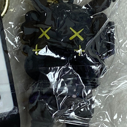 Assorted Carmela Indigo Silicone Keychain with Black kaws doll accessory