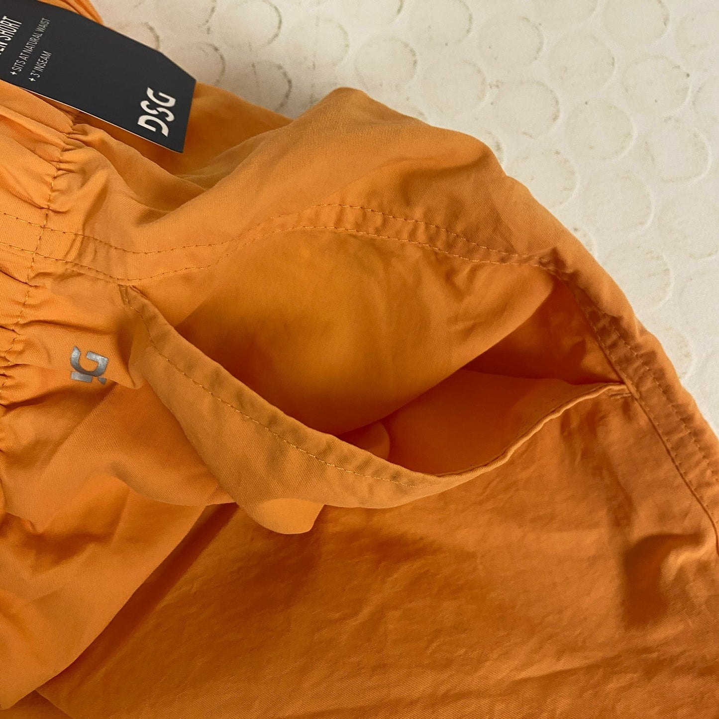 DSG Womenâs Notched Woven Shorts Light Orange Solid DAW13108