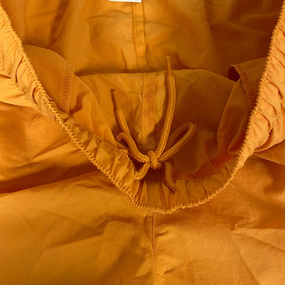 DSG Womenâs Notched Woven Shorts Light Orange Solid DAW13108