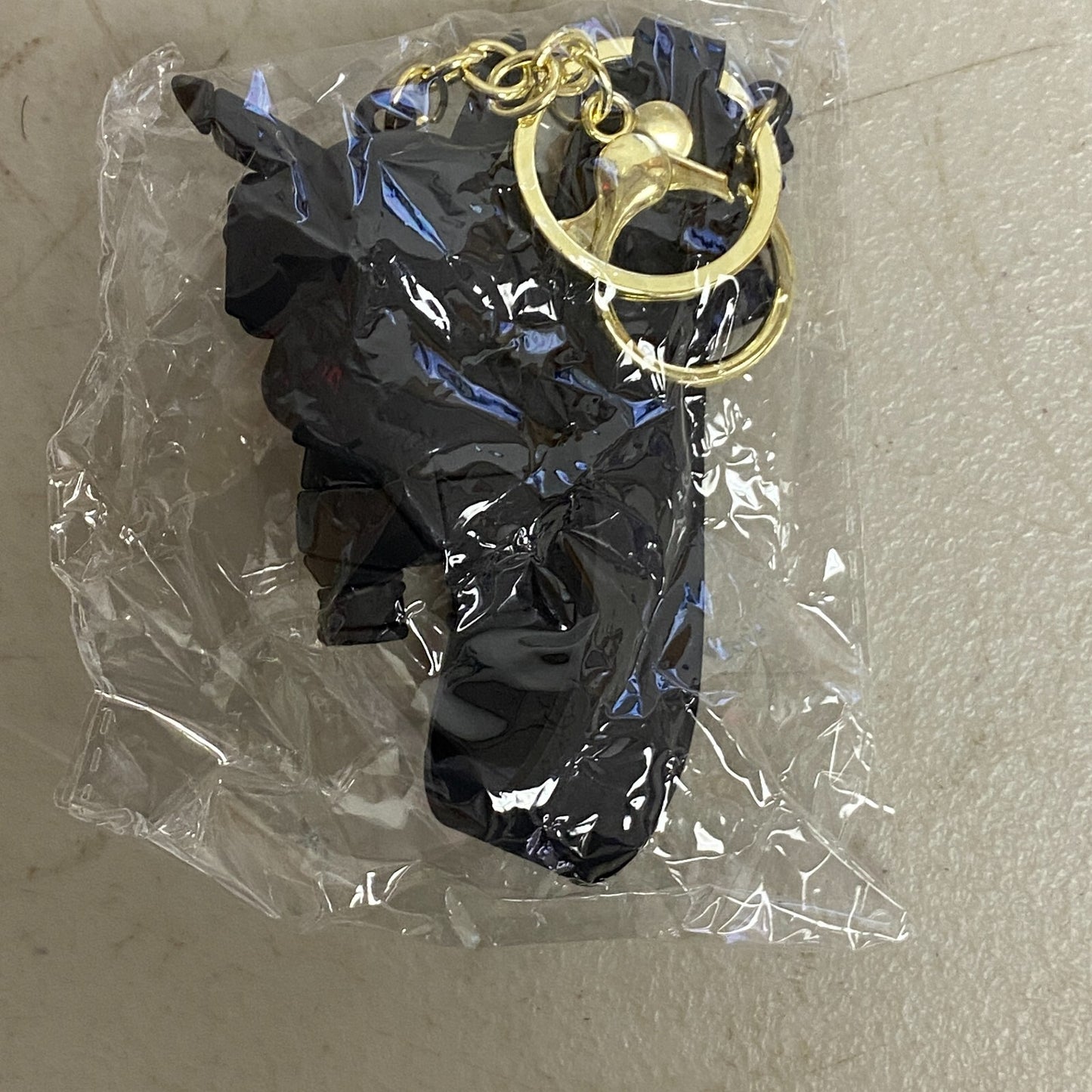 Assorted Carmela Indigo Silicone Keychain with Black kaws doll accessory