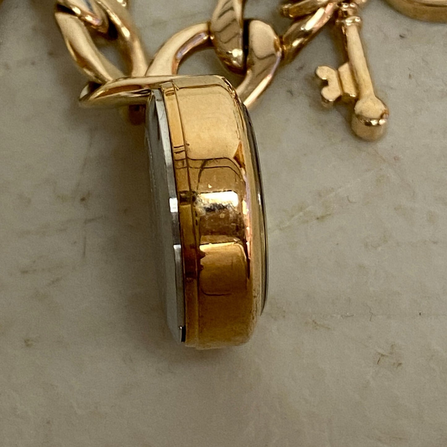 Armitron Women link bracelet with charm watch with key and lock charms 75/5067RG