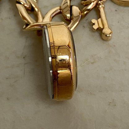 Armitron Women link bracelet with charm watch with key and lock charms 75/5067RG