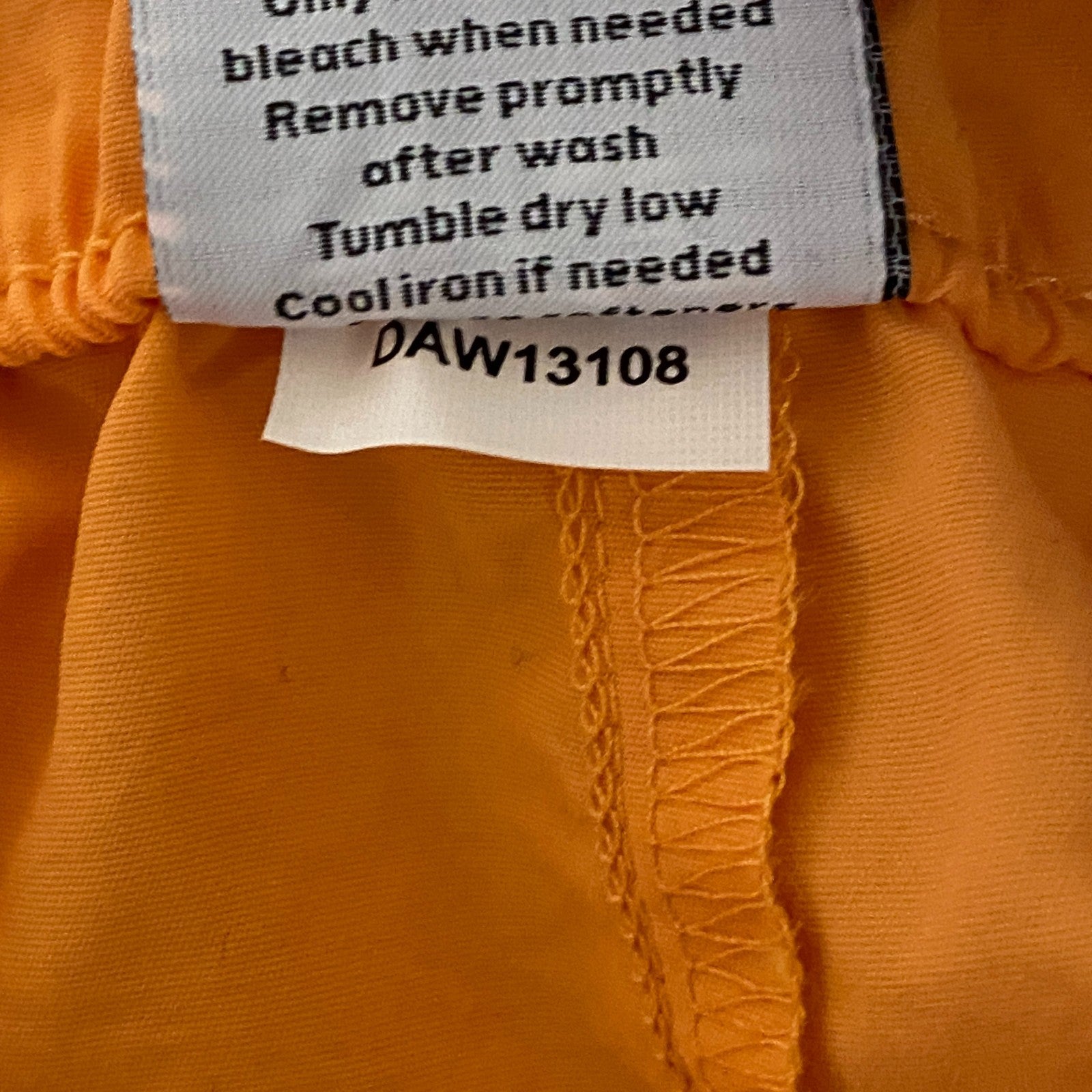 DSG Womenâs Notched Woven Shorts Light Orange Solid DAW13108