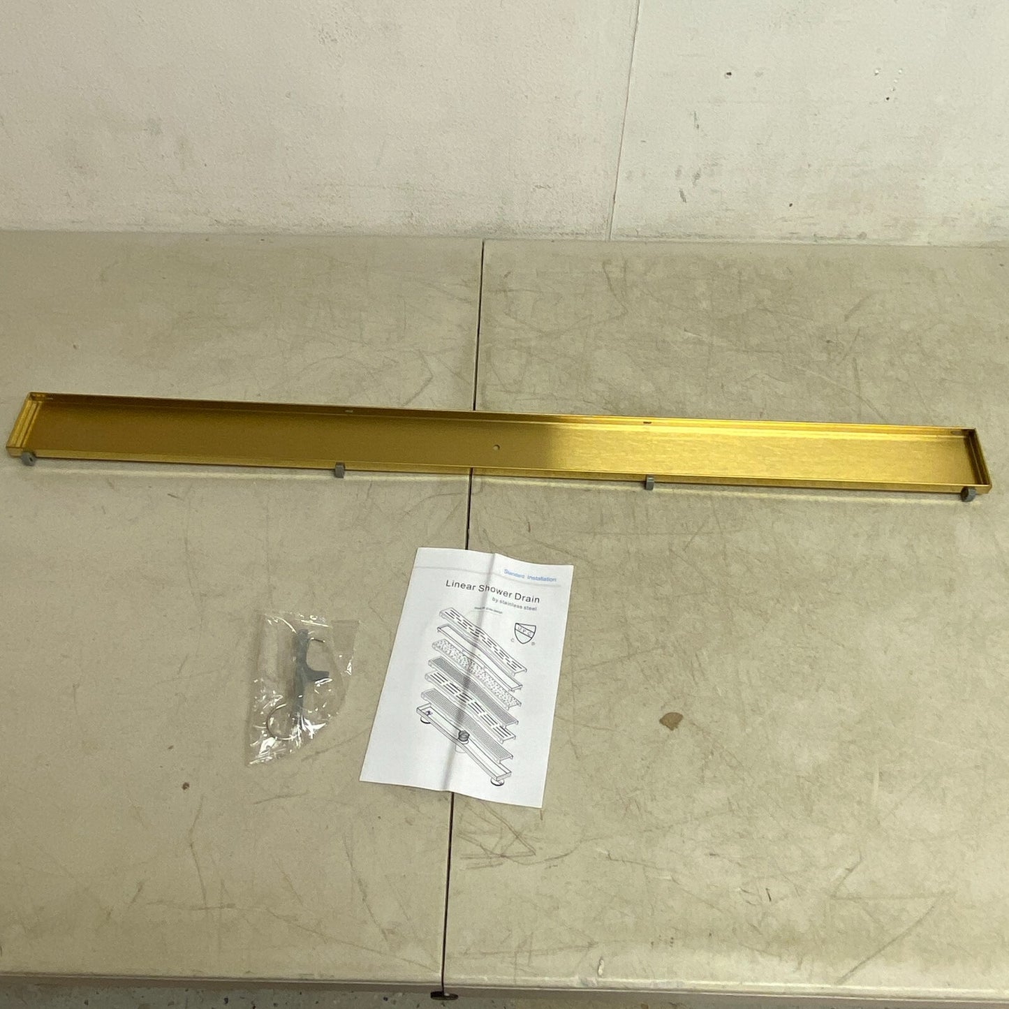 SIGNATURE HARDWARE 36" COHEN LINEAR TILE IN SOWER DRAIN-POLISHED BRASS