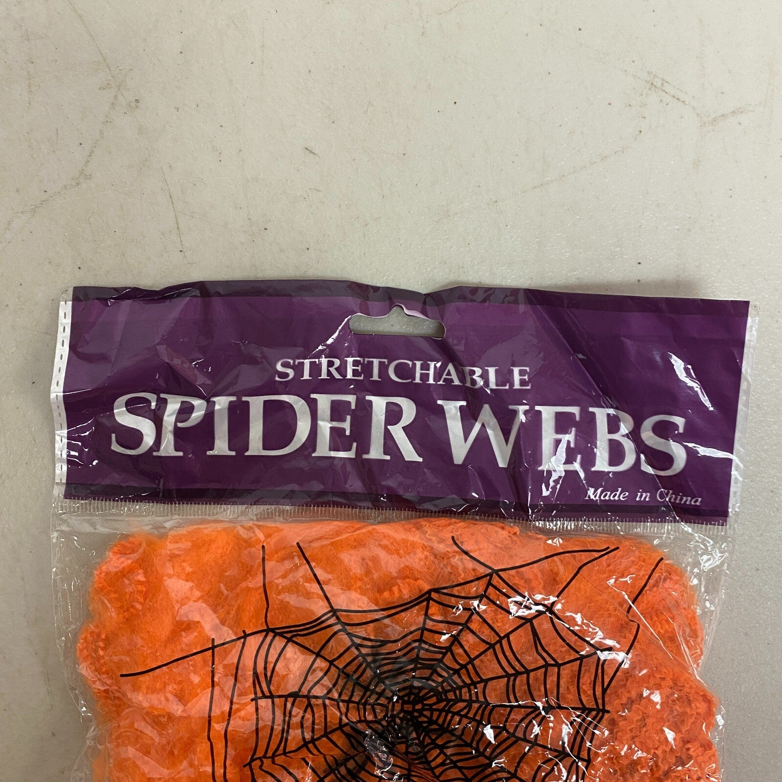 Stretchable Spider Web Decoration Orange w/ black spider Accents