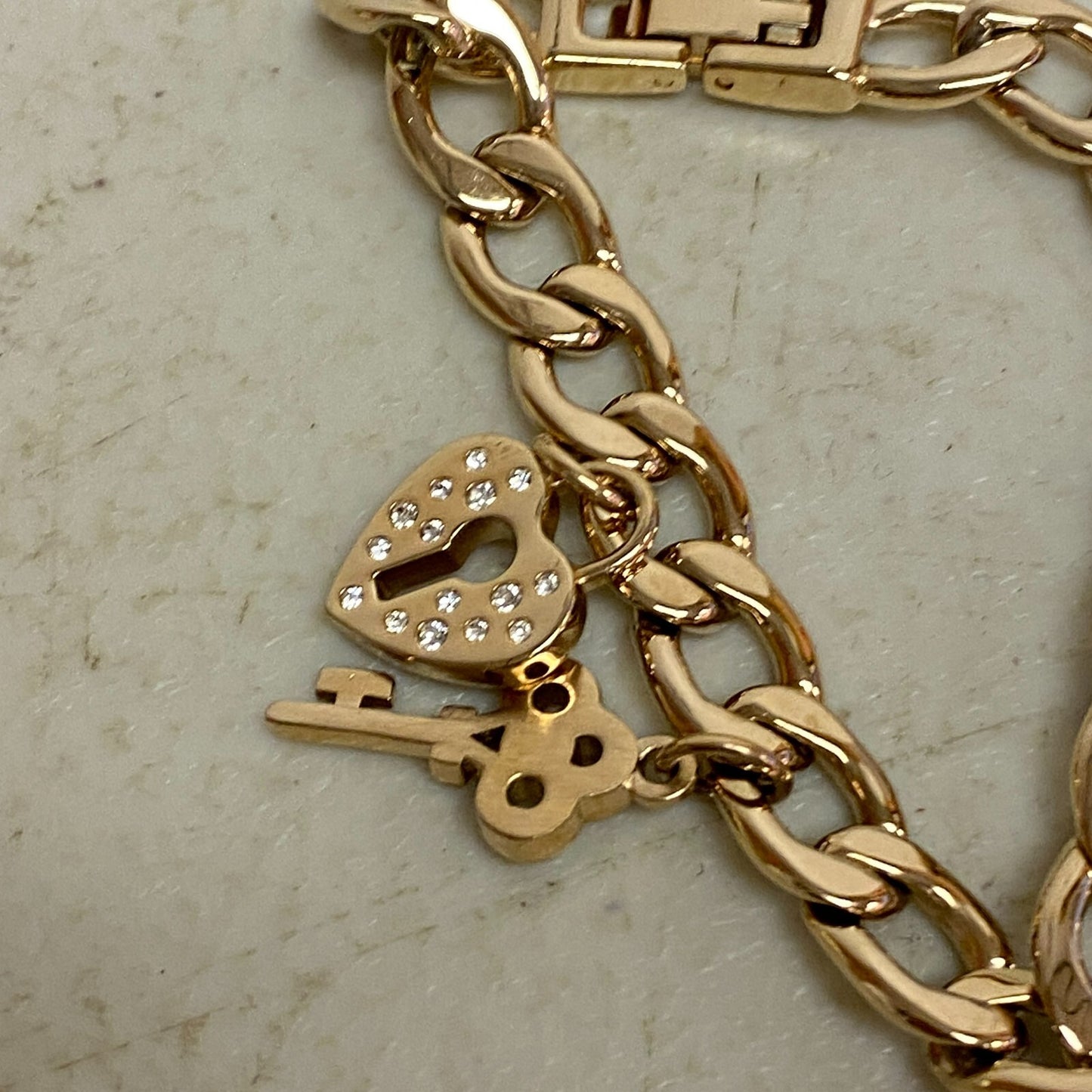 Armitron Women link bracelet with charm watch with key and lock charms 75/5067RG