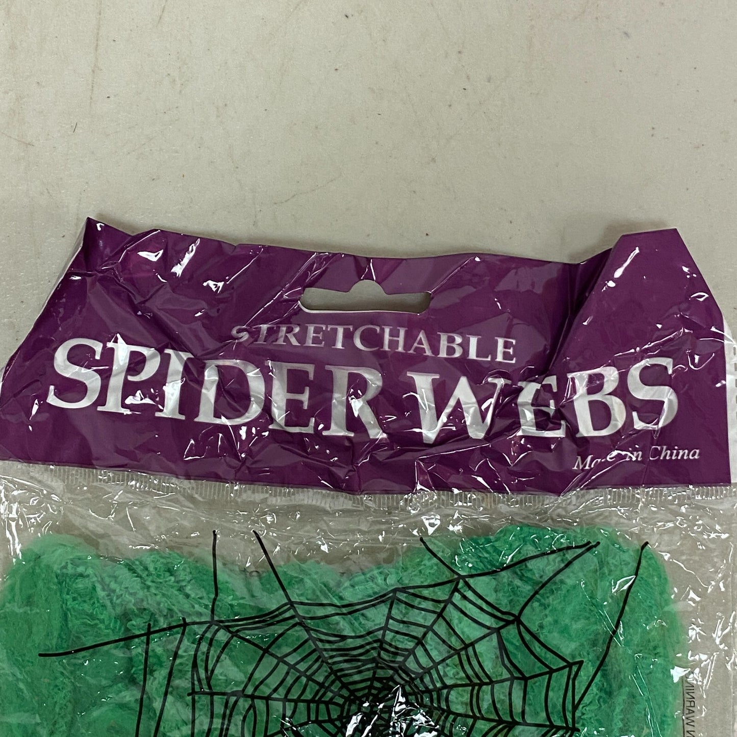 Stretchable Spider Web Decoration Green w/ black Spider Accents