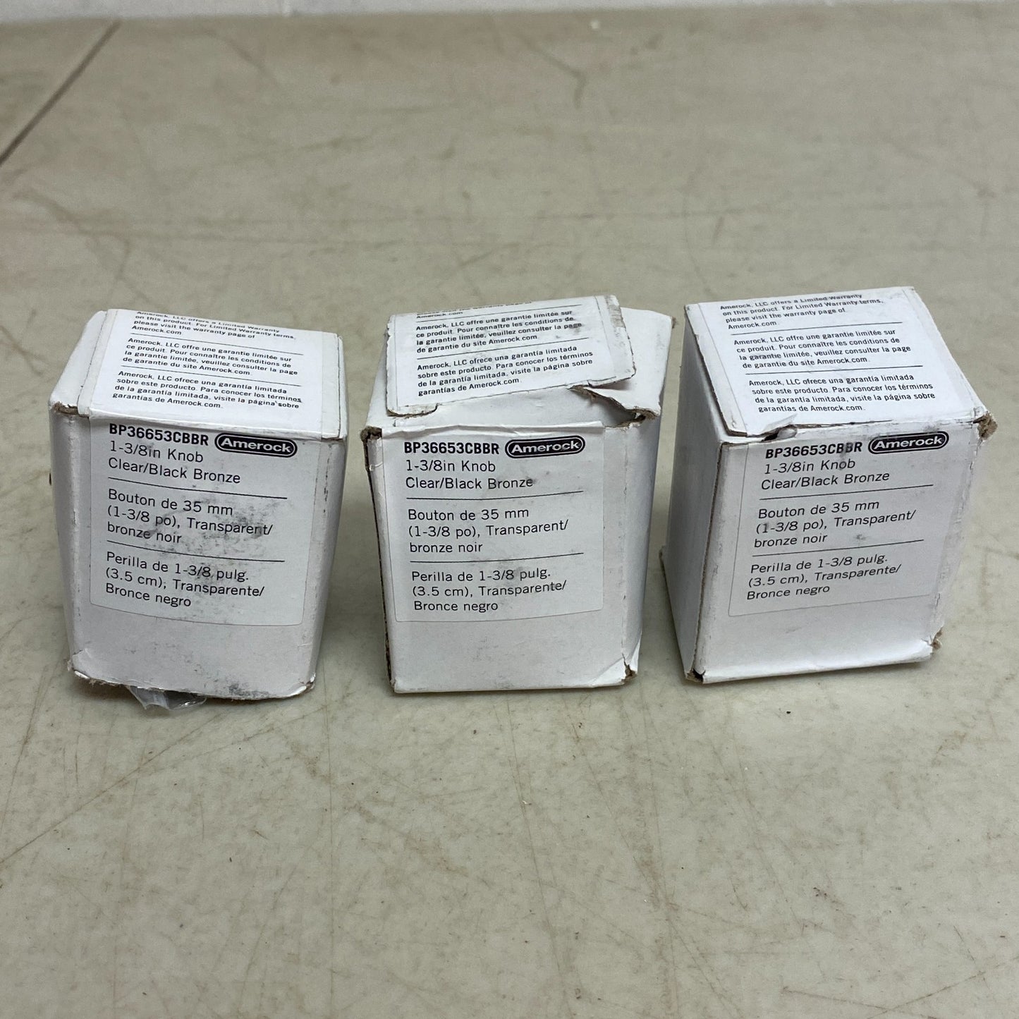 Amerock Glacio Collection 3 pack 1-3/8 in (35mm) Knob Clear/Black Bronze