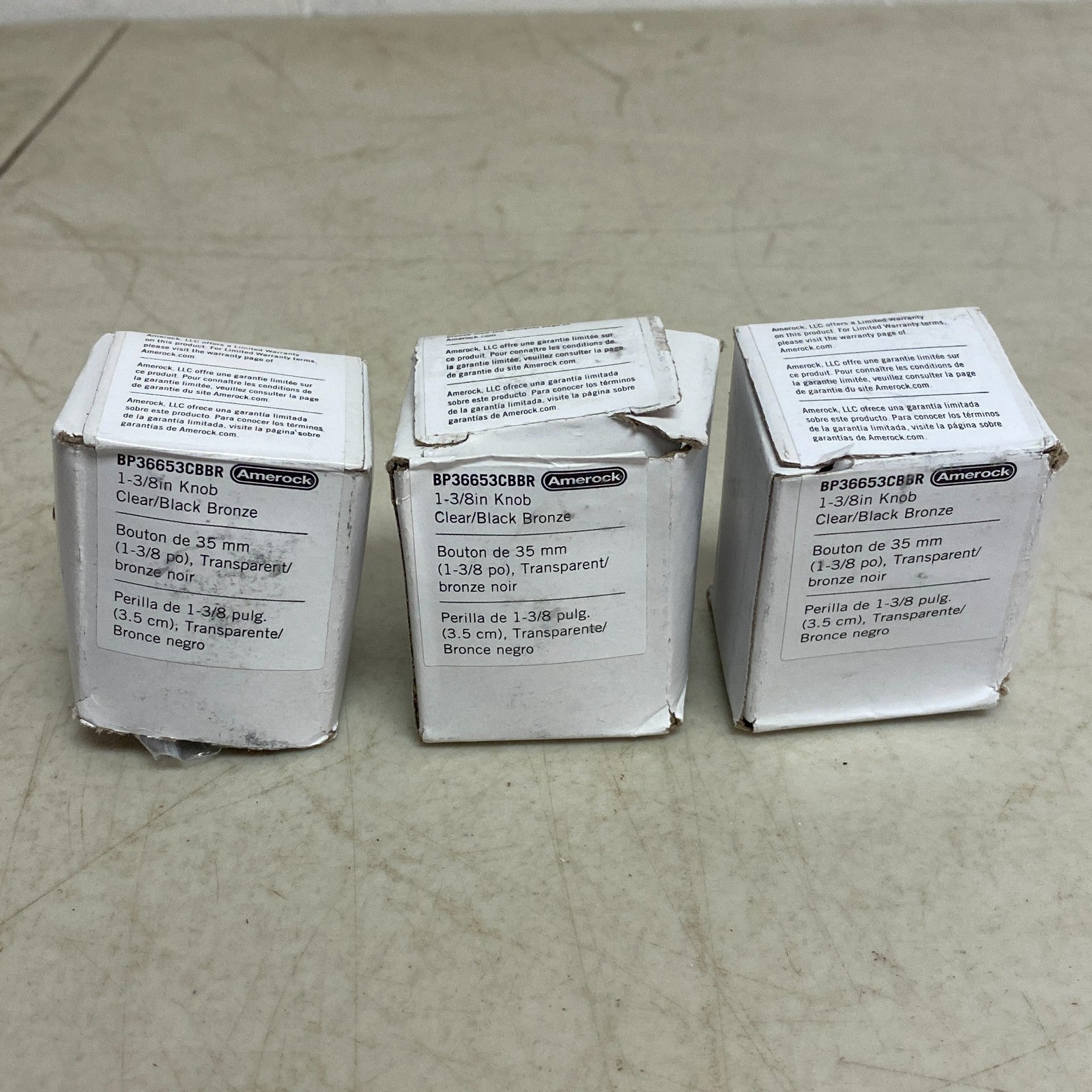 Amerock Glacio Collection 3 pack 1-3/8 in (35mm) Knob Clear/Black Bronze